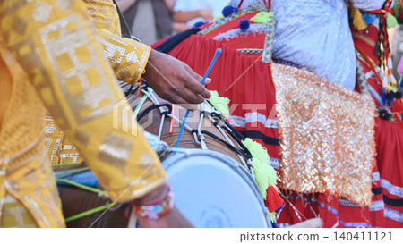 Indian dhol drummer playing during a cultural festival event in Moscow Indian dhol drummer playing during a cultural festival event in Moscow 140411121