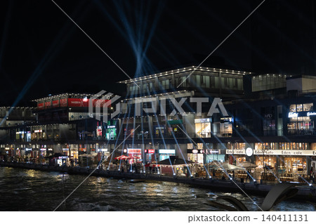 Tashkent, Uzbekistan - February 02, 2026: Seoul Mun Street. Blue and green Light Show at Seoul Mun Riverside District in Tashkent at Night. Tashkent, Uzbekistan - February 02, 2026: Seoul Mun Street. Blue and green Light Show at Seoul Mun Riverside District in Tashkent at Night. 140411131