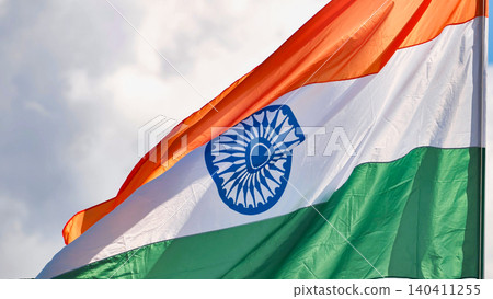 India flag waving, celebrating national culture and patriotism during India Day in Moscow India flag waving, celebrating national culture and patriotism during India Day in Moscow 140411255