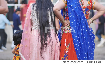 Indian women and child celebrating Ganesh Chaturthi in traditional ethnic attire Indian women and child celebrating Ganesh Chaturthi in traditional ethnic attire 140411308