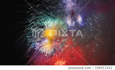 Colorful fireworks exploding in the night sky over Moscow celebrating holidays Colorful fireworks exploding in the night sky over Moscow celebrating holidays 140411432