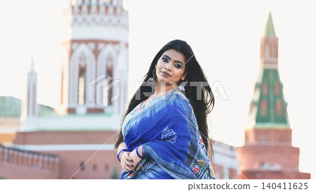 Bangladeshi woman traveler in traditional saree visiting Moscow Kremlin Bangladeshi woman traveler in traditional saree visiting Moscow Kremlin 140411625