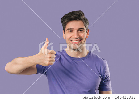 Handsome Man With Hand Sign Like, Thumbs Up Gesture.happy Guy On violet Studio Handsome Man With Hand Sign Like, Thumbs Up Gesture.happy Guy On violet Studio 140412333