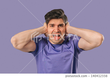 Stressed Shocked man Shouting, Guy In Shock on violet.Panicked facial expression 140412338