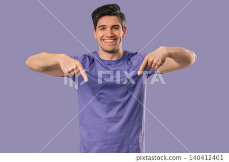 Mature Man Points Both Index Fingers Downward To Indicate Area Below On Violet Mature Man Points Both Index Fingers Downward To Indicate Area Below On Violet 140412401