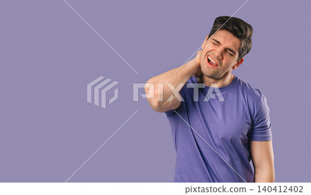 Man Suffering From Neck Pain and Muscle Stiffness on Purple Background. fatigue 140412402