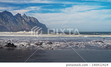 Atlantic Ocean Waves Hitting Volcanic Rocks On Rugged Coastal Shoreline, Canary Atlantic Ocean Waves Hitting Volcanic Rocks On Rugged Coastal Shoreline, Canary 140412424