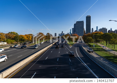 Chicago, Illinois, USA - October 25, 2024: Road way with car. City road full of car. Urban autumn. Urban road way highway. Car traffic on autumn road highway. City destination highway Chicago, Illinois, USA - October 25, 2024: Road way with car. City road full of car. Urban autumn. Urban road way highway. Car traffic on autumn road highway. City destination highway 140412707