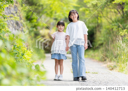 girls walking hand in hand girls walking hand in hand 140412713