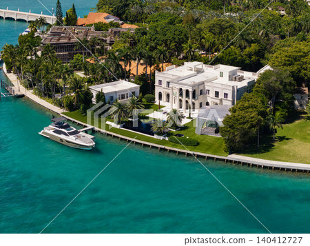 Waterfront landscape with house. Vacation in summer. Luxury waterfront hotel building. Summer vacation. Landscape luxury residential area. Residential waterfront apartment with private boat Waterfront landscape with house. Vacation in summer. Luxury waterfront hotel building. Summer vacation. Landscape luxury residential area. Residential waterfront apartment with private boat 140412727