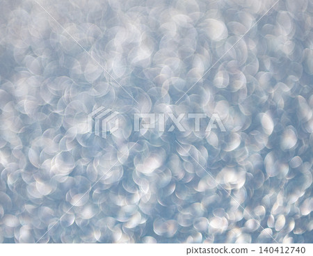 Defocused shimmer. Bokeh backdrop shimmer. Bokeh effect. Glitter shine. Bokeh shimmering background. Blurred defocused background. Blur glitter backdrop. Glitter shimmer background. Glitter glows 140412740