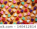 Colorful heart-shaped chocolate flat lay background image 140412814