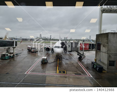 Buenos Aires, Argentina - March 29, 2026: Passenger aircraft parked at the gate at Aeroparque Jorge Newbery during rainy weather. Buenos Aires, Argentina - March 29, 2026: Passenger aircraft parked at the gate at Aeroparque Jorge Newbery during rainy weather. 140412988