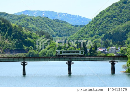 A diesel train crossing the full Kinshu Lake. 140413379
