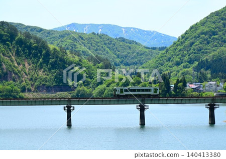 A diesel train crossing the full Kinshu Lake. A diesel train crossing the full Kinshu Lake. 140413380