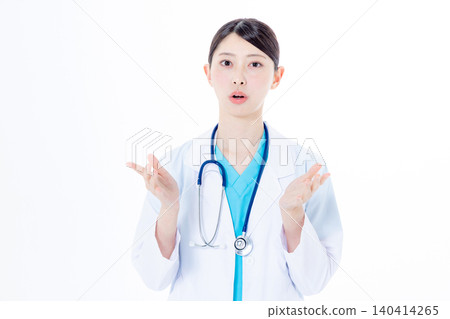 Female doctor speaking from the camera Female doctor speaking from the camera 140414265