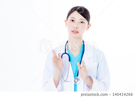Female doctor speaking from the camera Female doctor speaking from the camera 140414268