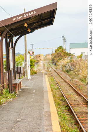 The platform of Nishi-Ōyama Station, the expansive landscape, and the railway tracks. The platform of Nishi-Ōyama Station, the expansive landscape, and the railway tracks. 140414326