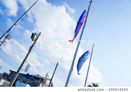 Colorful carp streamers swimming in the blue sky Colorful carp streamers swimming in the blue sky 140414344