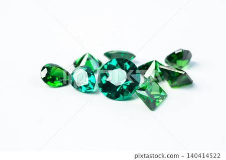raw emeralds, gemstone jewelry isolated on white background 140414522