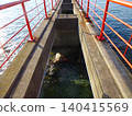 The red bridge at Tsushima Shrine (Mitoyo City, Kagawa Prefecture) can only be crossed during the two-day annual festival. 140415569