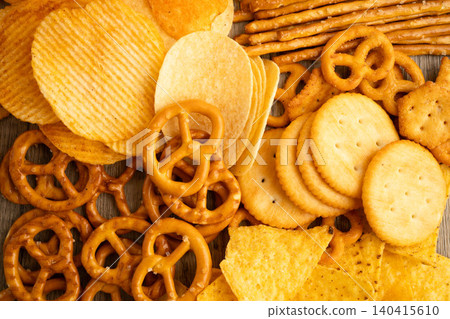 Mix of variety snack chips pretzel and cracker, junk crunchy food. Mix of variety snack chips pretzel and cracker, junk crunchy food. 140415610