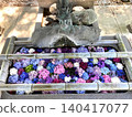 A water basin with colorful floating hydrangeas 140417077