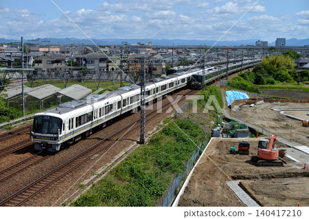 221 series local trains and 223 series rapid trains running on the JR Kyoto Line 221 series local trains and 223 series rapid trains running on the JR Kyoto Line 140417210
