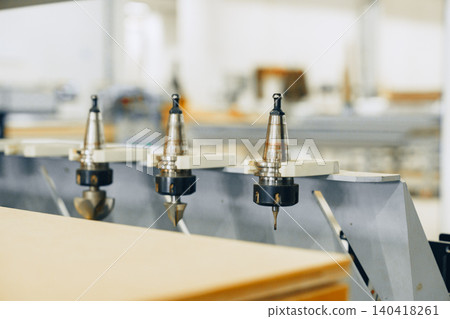 Work process in furniture workshop using tools and machines for wood crafting Work process in furniture workshop using tools and machines for wood crafting 140418261