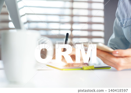 CRM strategy discussion takes place in an office with a cup of coffee on the table CRM strategy discussion takes place in an office with a cup of coffee on the table 140418597
