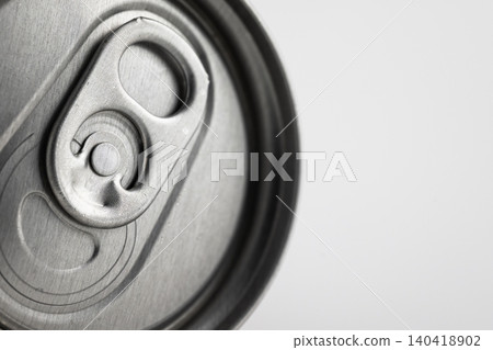 Macro shot of a silver metallic beverage can top with shallow depth of field on white background 140418902