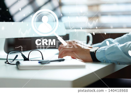 Using CRM software on computer for customer management in a modern office setting Using CRM software on computer for customer management in a modern office setting 140418988
