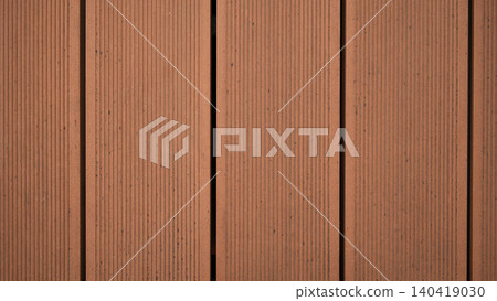 Clean vertical view showing the detailed wood grain and lines of brown composite decking planks Clean vertical view showing the detailed wood grain and lines of brown composite decking planks 140419030