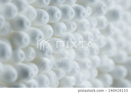 High angle macro view of arranged white cotton bud tips forming a dense geometric pattern High angle macro view of arranged white cotton bud tips forming a dense geometric pattern 140419133