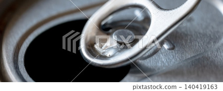 Close-up detail of an opened soda can top, focusing on the pull tab and metallic texture Close-up detail of an opened soda can top, focusing on the pull tab and metallic texture 140419163