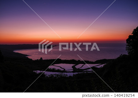 A nostalgic and breathtaking view of the sea and terraced rice fields. A nostalgic and breathtaking view of the sea and terraced rice fields. 140419254