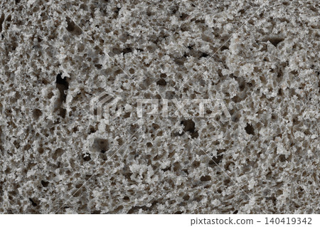 Extreme close-up of porous whole grain rye bread texture with natural lighting and soft shadows Extreme close-up of porous whole grain rye bread texture with natural lighting and soft shadows 140419342