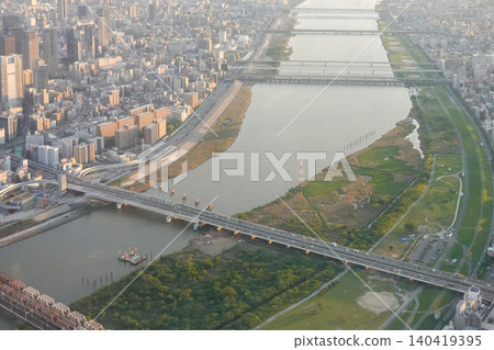 The Yodo River at dusk, as seen from an airplane (photographed in May 2026) above Osaka City. The Yodo River at dusk, as seen from an airplane (photographed in May 2026) above Osaka City. 140419395