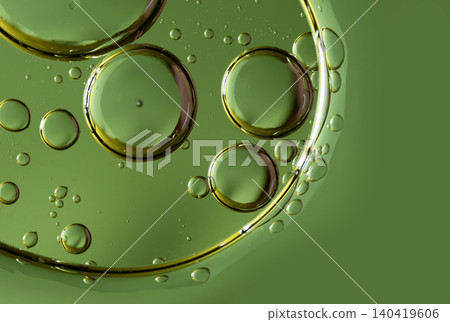 Overlapping oil spheres on a vivid green background suggesting organic cell structures Overlapping oil spheres on a vivid green background suggesting organic cell structures 140419606