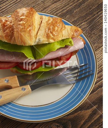 Croissant sandwich breakfast ham lettuce Croissant sandwich breakfast ham lettuce 140419650