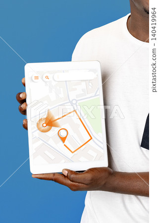 Person holds a tablet displaying a map with taxi route and destination marked clearly Person holds a tablet displaying a map with taxi route and destination marked clearly 140419964