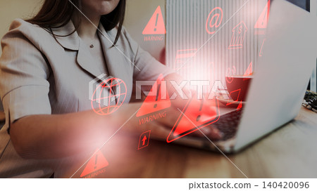 Scam message shows warning signs and alerts during online activity on a laptop Scam message shows warning signs and alerts during online activity on a laptop 140420096