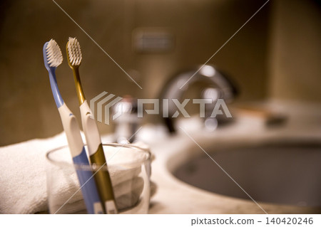 Toothbrush and sink in the bathroom 140420246