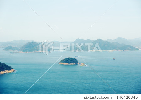 Ocean, nature and aerial of island for travel, holiday and vacation destination in summer. Natural background, seascape and rock islands in water for scenic view in environment, ecosystem and waves Ocean, nature and aerial of island for travel, holiday and vacation destination in summer. Natural background, seascape and rock islands in water for scenic view in environment, ecosystem and waves 140420349