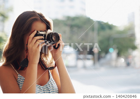 Woman, photography and city street with camera for photo, memory or capturing outdoor moment. Female person, tourist or photographer taking picture with lens for sightseeing or travel in urban town Woman, photography and city street with camera for photo, memory or capturing outdoor moment. Female person, tourist or photographer taking picture with lens for sightseeing or travel in urban town 140420846