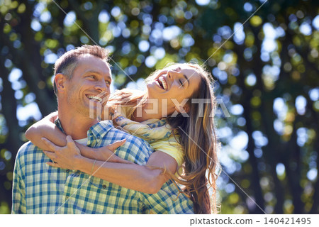 Piggy back, laugh and couple in park for summer romance, trees and fun outdoor date with smile. Love, mature man and happy woman in garden with morning sunshine, hug and marriage bonding in nature. Piggy back, laugh and couple in park for summer romance, trees and fun outdoor date with smile. Love, mature man and happy woman in garden with morning sunshine, hug and marriage bonding in nature. 140421495