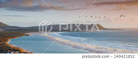 Water, drone and beach sunset with peace, beauty and location tranquility in nature. Aerial view, freedom and ocean sunrise for summer, travel or vacation, holiday or stress relief in South Africa Water, drone and beach sunset with peace, beauty and location tranquility in nature. Aerial view, freedom and ocean sunrise for summer, travel or vacation, holiday or stress relief in South Africa 140421852