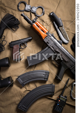 Items used for security and law enforcement, displayed on a brown cloth background Items used for security and law enforcement, displayed on a brown cloth background 140421950