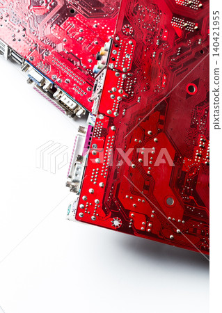 Red circuit boards with detailed electronic components placed on a white surface Red circuit boards with detailed electronic components placed on a white surface 140421955