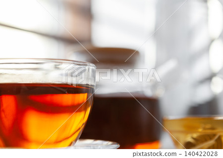 Hot cup of tea on wooden rustic table close up 140422028
